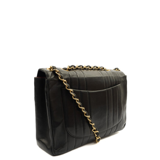 Chanel Shoulder Bag Maxi Jumbo XL in Black, Leather — Side View