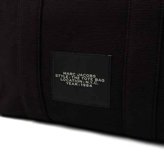Marc Jacobs Tote The Tote Bag in Black, Fabric — Side View