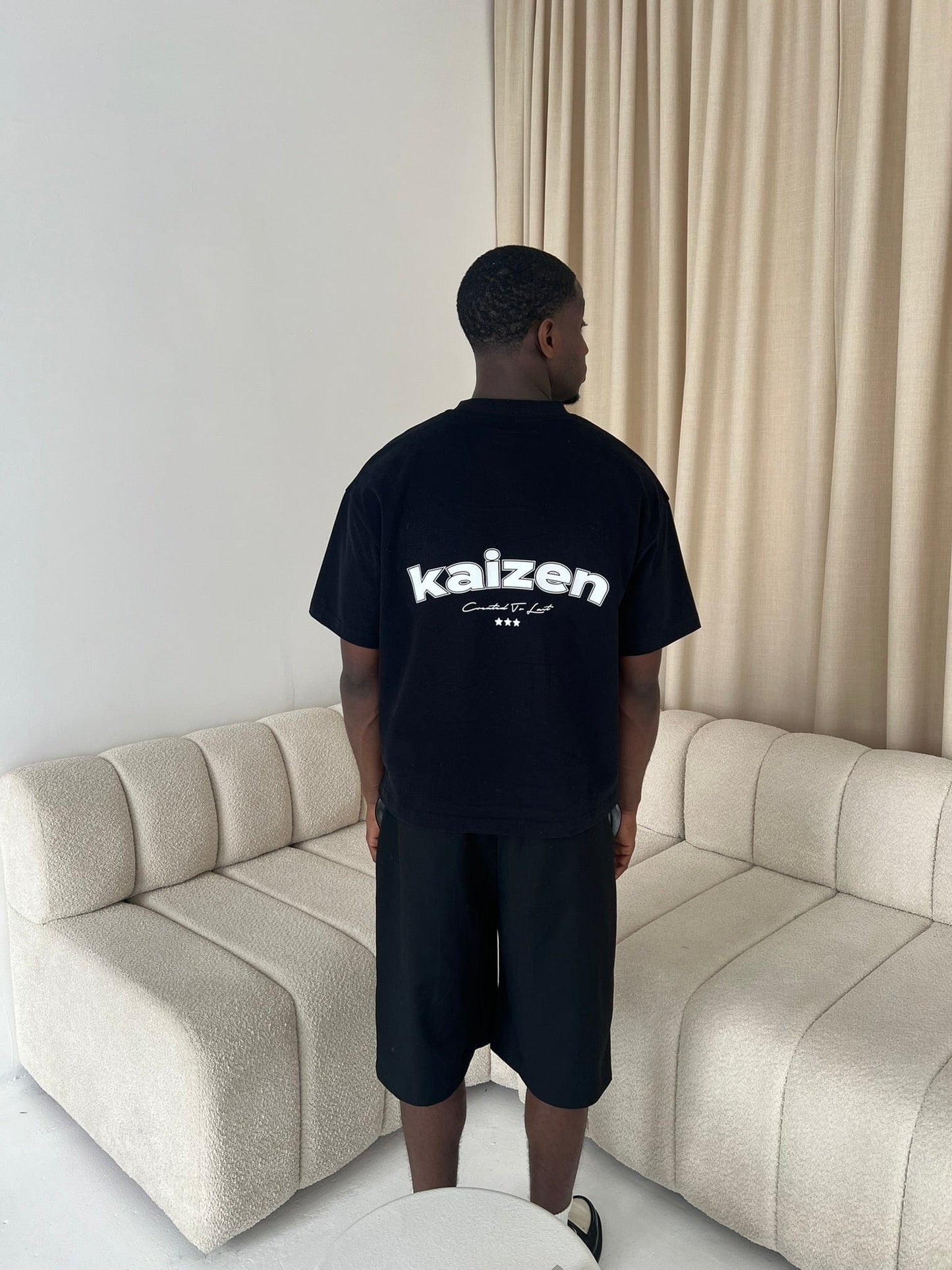 KAIZEN MARKET ARCH TEE BLACK — XS — Top View