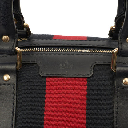 Gucci Top Handle Vintage Web Boston - Medium in GG Supreme Canvas — Lifestyle View
