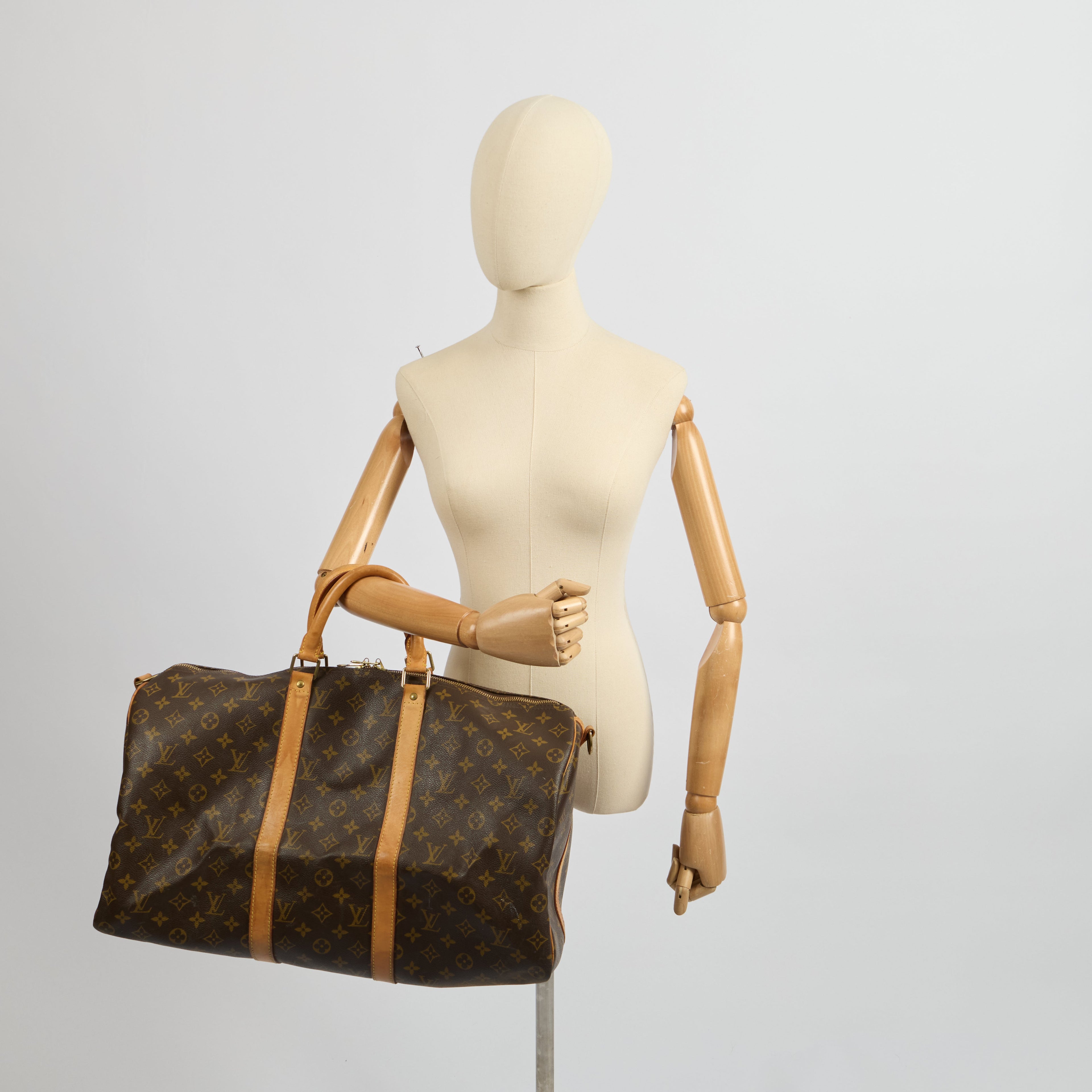Louis Vuitton Tote Keepall 50 Bandouliere in Monogram, Canvas — Side View