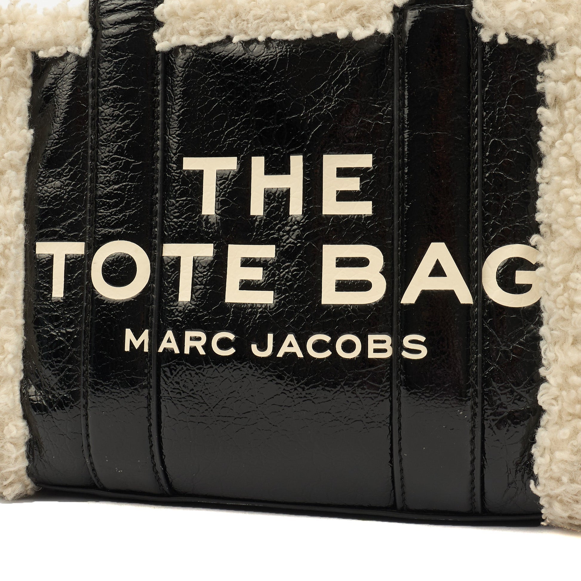 Marc Jacobs Tote The Tote Bag Nano in tonal black, Leather — Side View