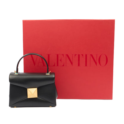 Valentino Top Handle Roman Stud The Handle Bag - Small in Black, Calfskin — Lifestyle View