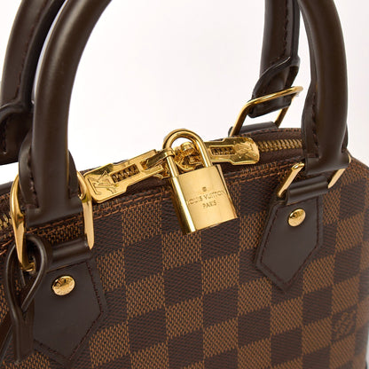 Louis Vuitton Top Handle Alma BB in Damier Geant, Canvas — Lifestyle View