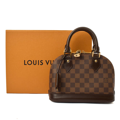 Louis Vuitton Top Handle Alma BB in Damier Geant, Canvas — Side View