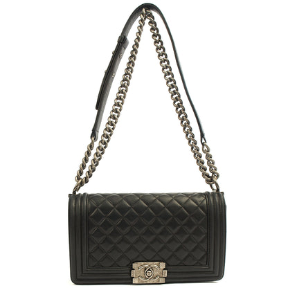 Chanel Shoulder Bag Boy - Medium in Black, Calfskin Leather — Lifestyle View