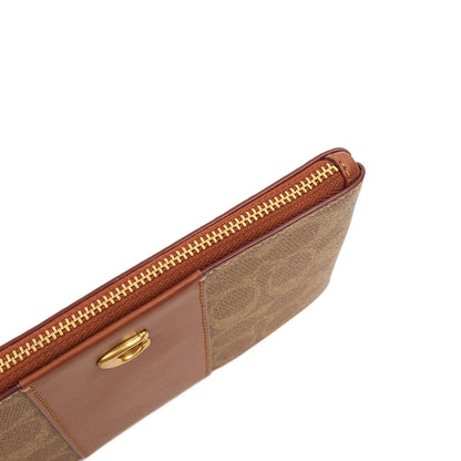 Coach Clutch Bow Wristlet in Brown, Leather — Lifestyle View