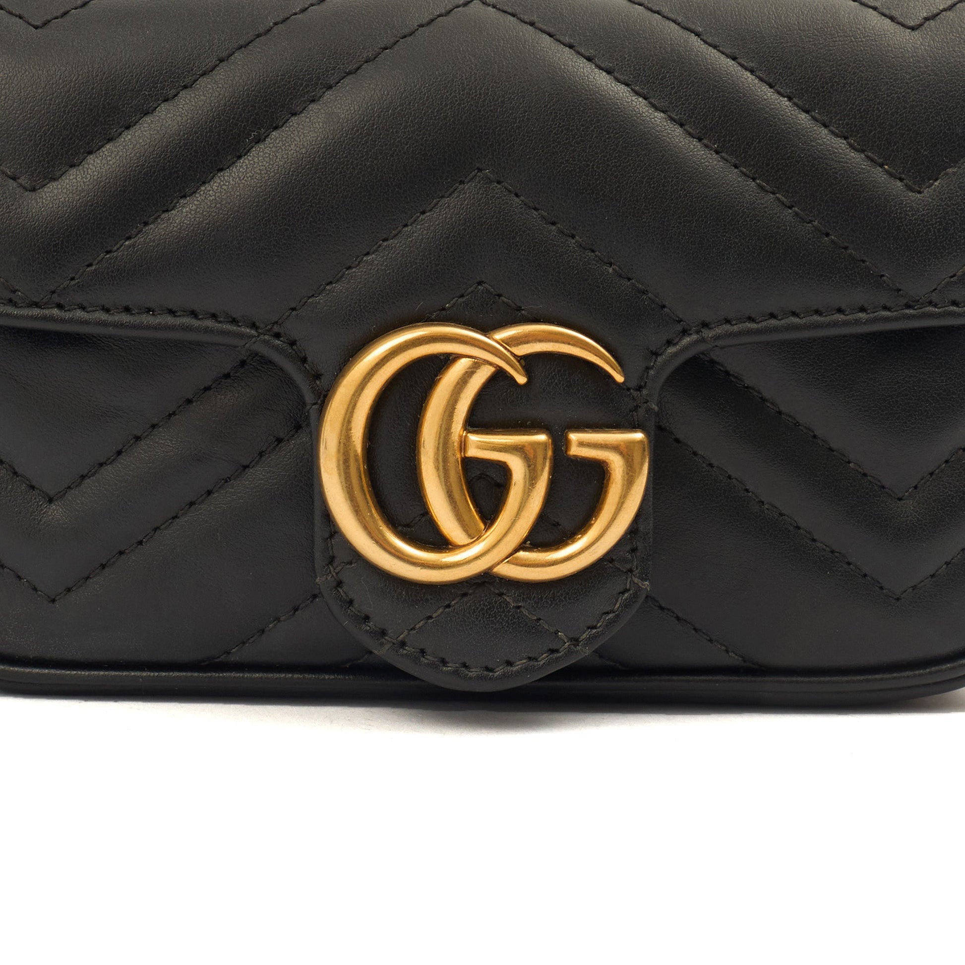 Gucci Mini Bag Marmont Shoulder Flap Bag - Super Mini in Black, Leather — Lifestyle View