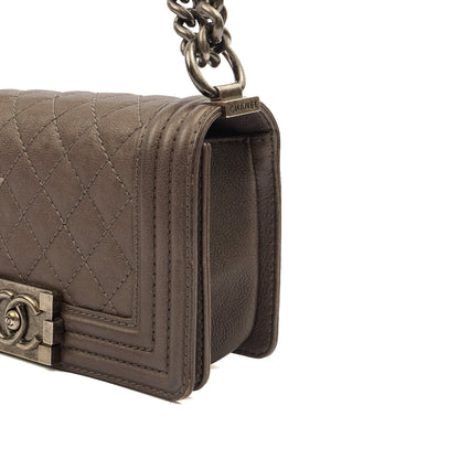 Chanel Shoulder Bag Boy - Mini in Metallic, Calfskin Leather — Lifestyle View