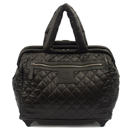 Chanel Wheeled Coco Cocoon in Black, Fabric — Front View