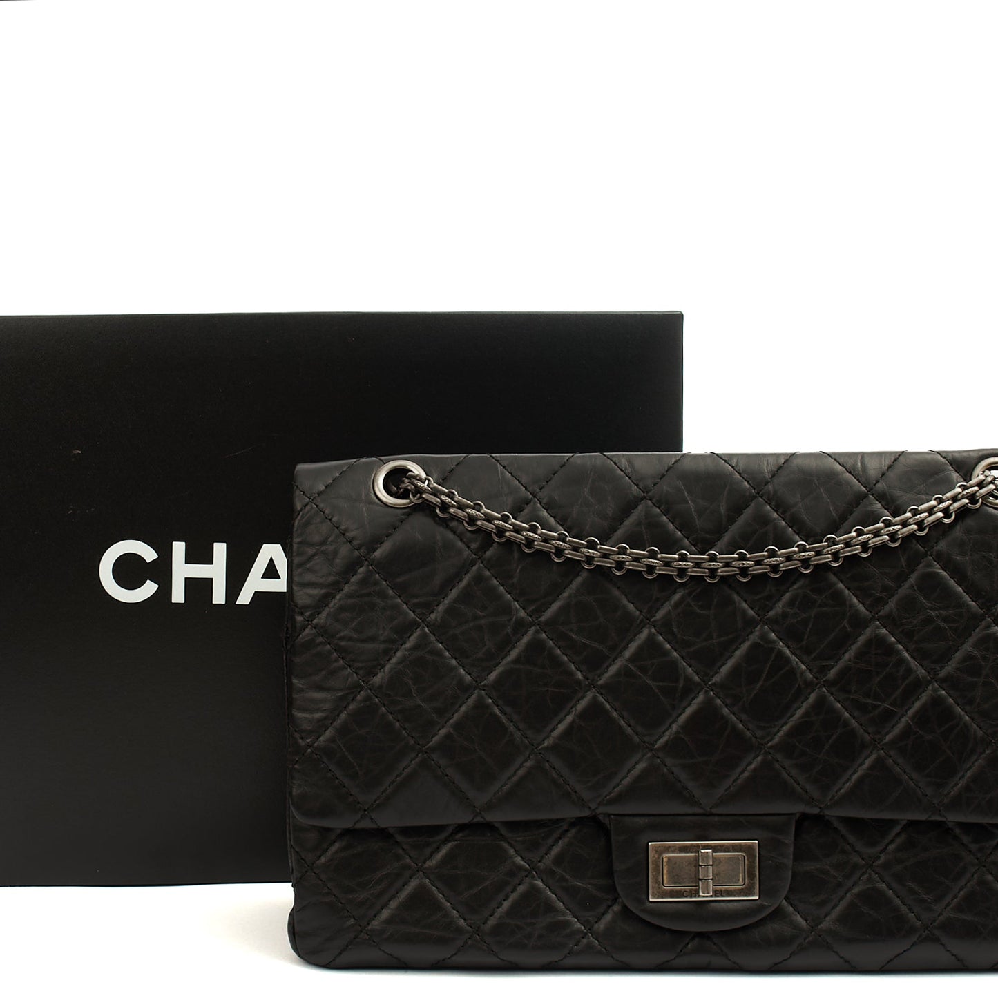 Chanel Shoulder Bag 2.55 Reissue - Maxi in Black, Crinkled Calfskin Leather — Lifestyle View