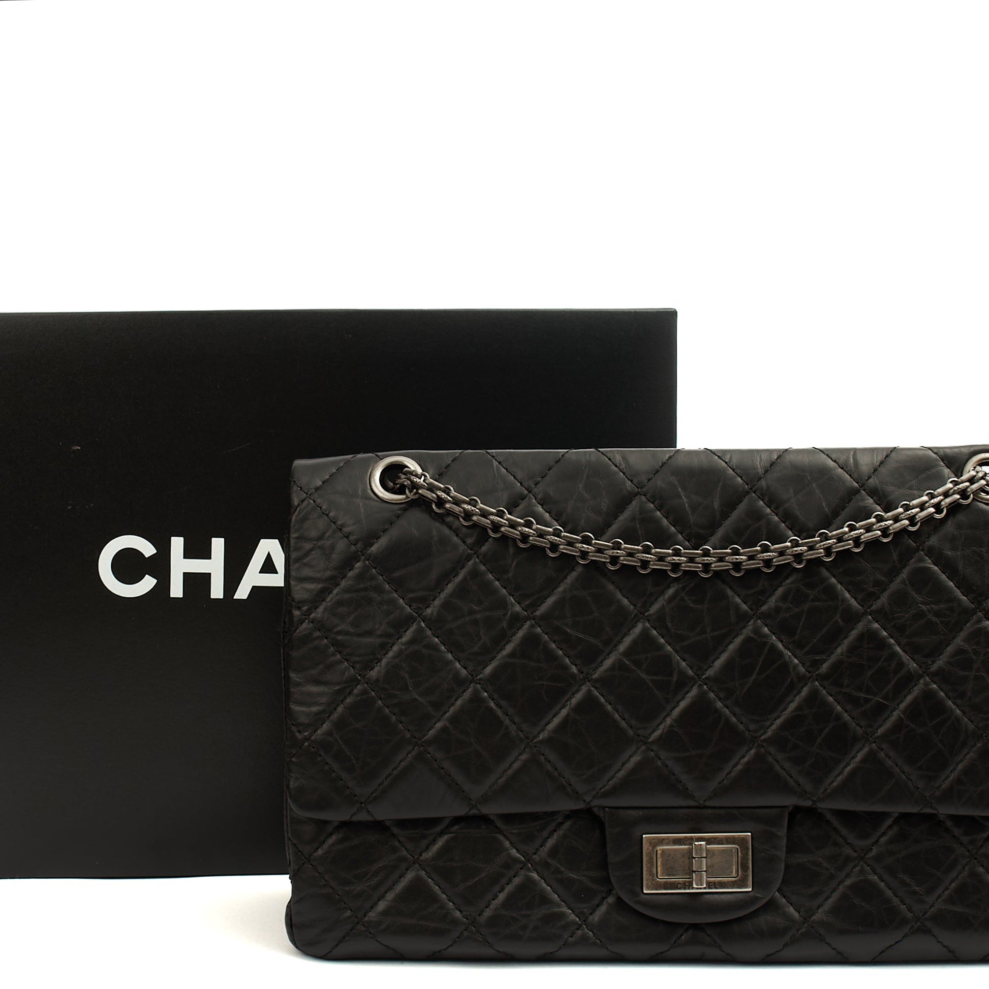 Chanel Shoulder Bag 2.55 Reissue - Maxi in Black, Crinkled Calfskin Leather — Lifestyle View