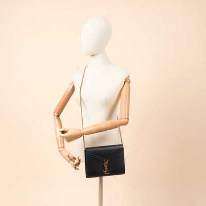 Saint Laurent Cross Body Cassandre Chain Flap Bag in Black, Calfskin Leather — Side View