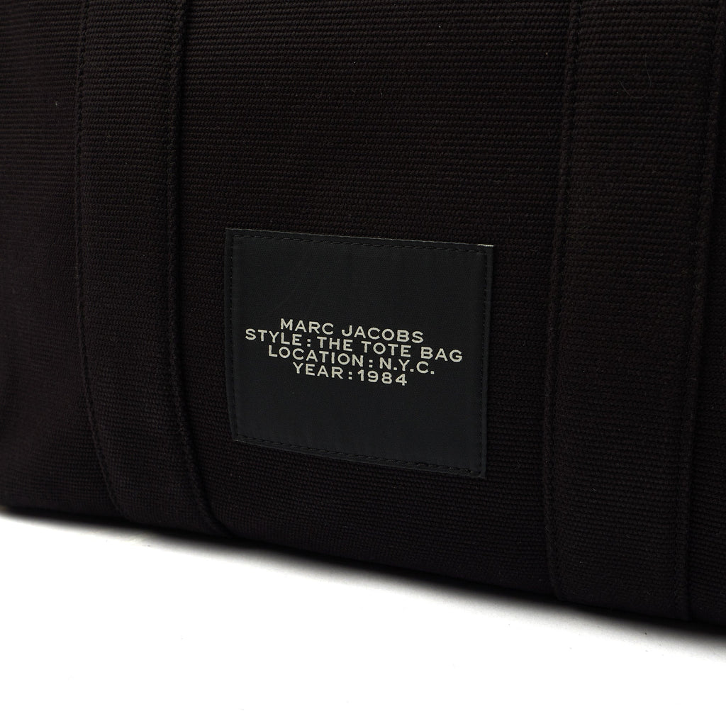 Marc Jacobs Tote The Tote Bag in Black, Fabric — Side View