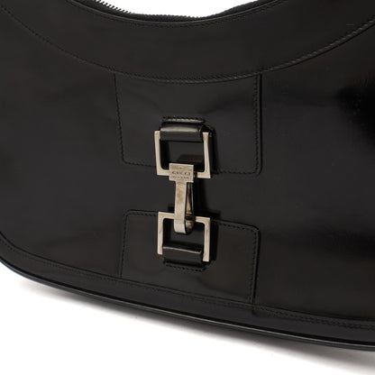 Gucci Shoulder Bag Jackie in Black, Patent Leather — Lifestyle View