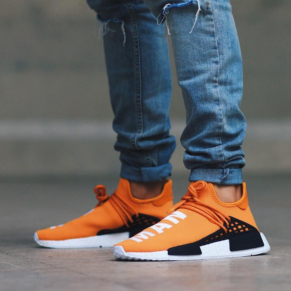PHARRELL WILLIAMS X ADIDAS NMD HUMAN RACE  TANGERINE — UK 3.5 | EU 36 | US 4 — Lifestyle View